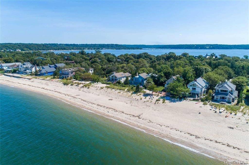 Embrace the toes in the sand lifestyle with this stunning custom designed 3 bedroom Colonial, perfectly situated on the shores of Long Island Sound.