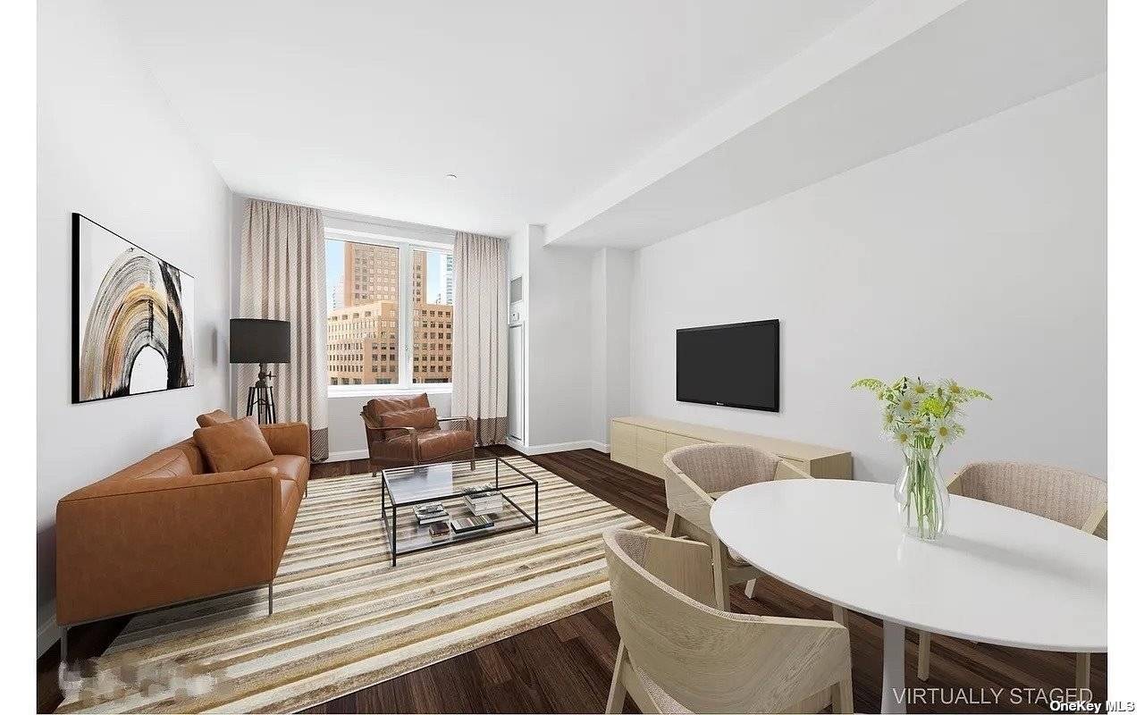 The Oro Condominium, a stunning Condominium with a magnificent exterior glass facade soaring 40 stories above the trendy landscape of downtown Brooklyn.