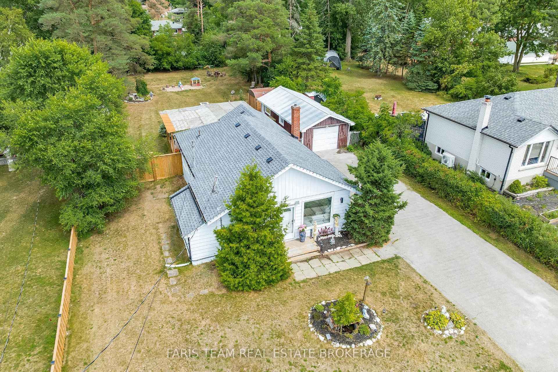 Top 5 Reasons You Will Love This Home 1 Nestled on a spacious property, this well kept bungalow boasts a quiet escape surrounded by mature greenery, ideal for those seeking ...