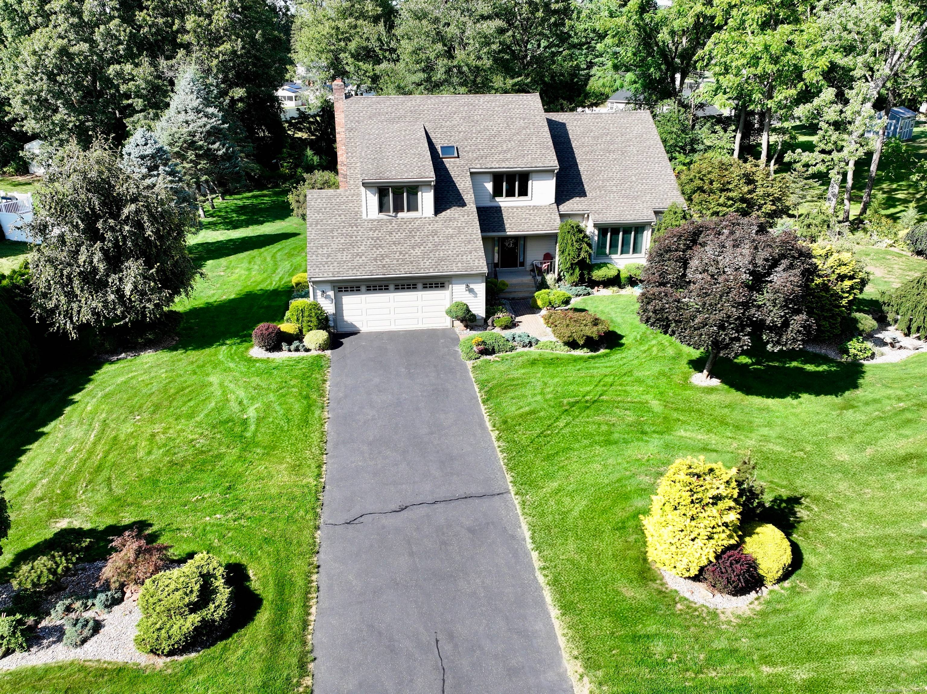 This exceptional home has been renovated from top to bottom with custom trim work, built ins, a designer kitchen, home office, and extraordinary exterior details.