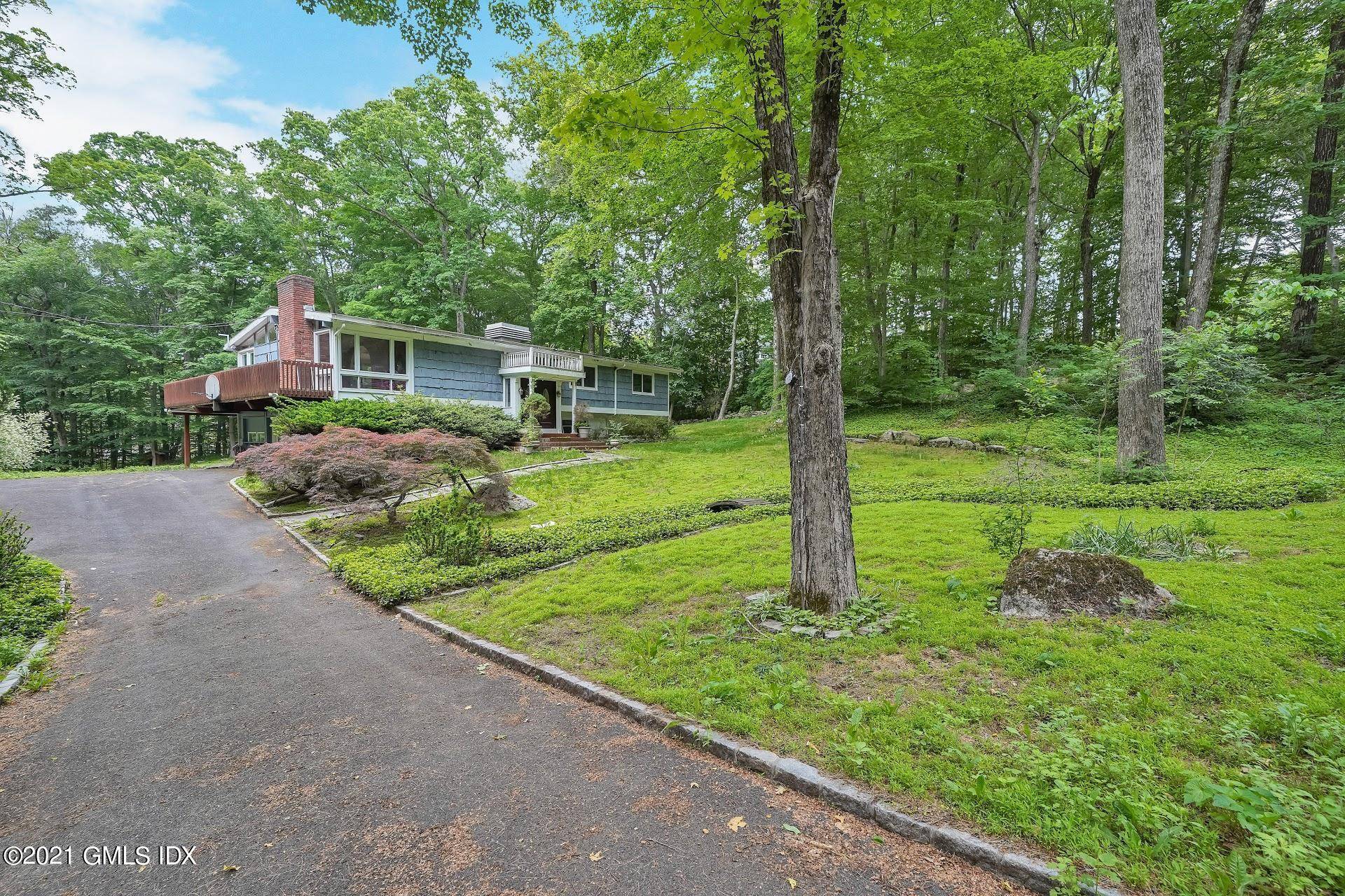 Amazing opportunity to re model or re build on this beautiful and large 2 acre lot in very desirable neighborhood on Nutmeg.