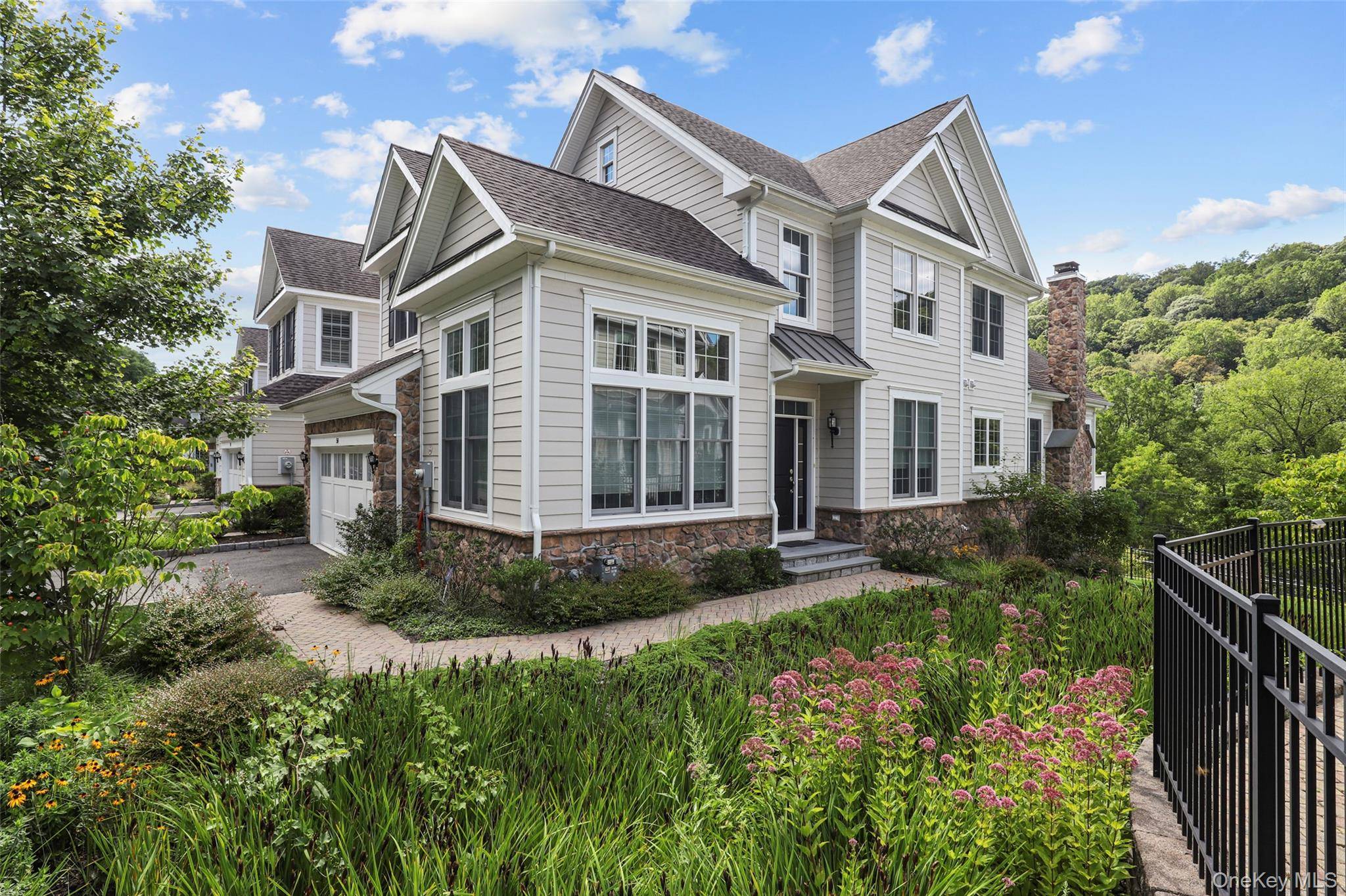 Set privately in the highly sought after Enclave neighborhood, this beautiful end unit offers the perfect blend of luxury, space, and convenience.