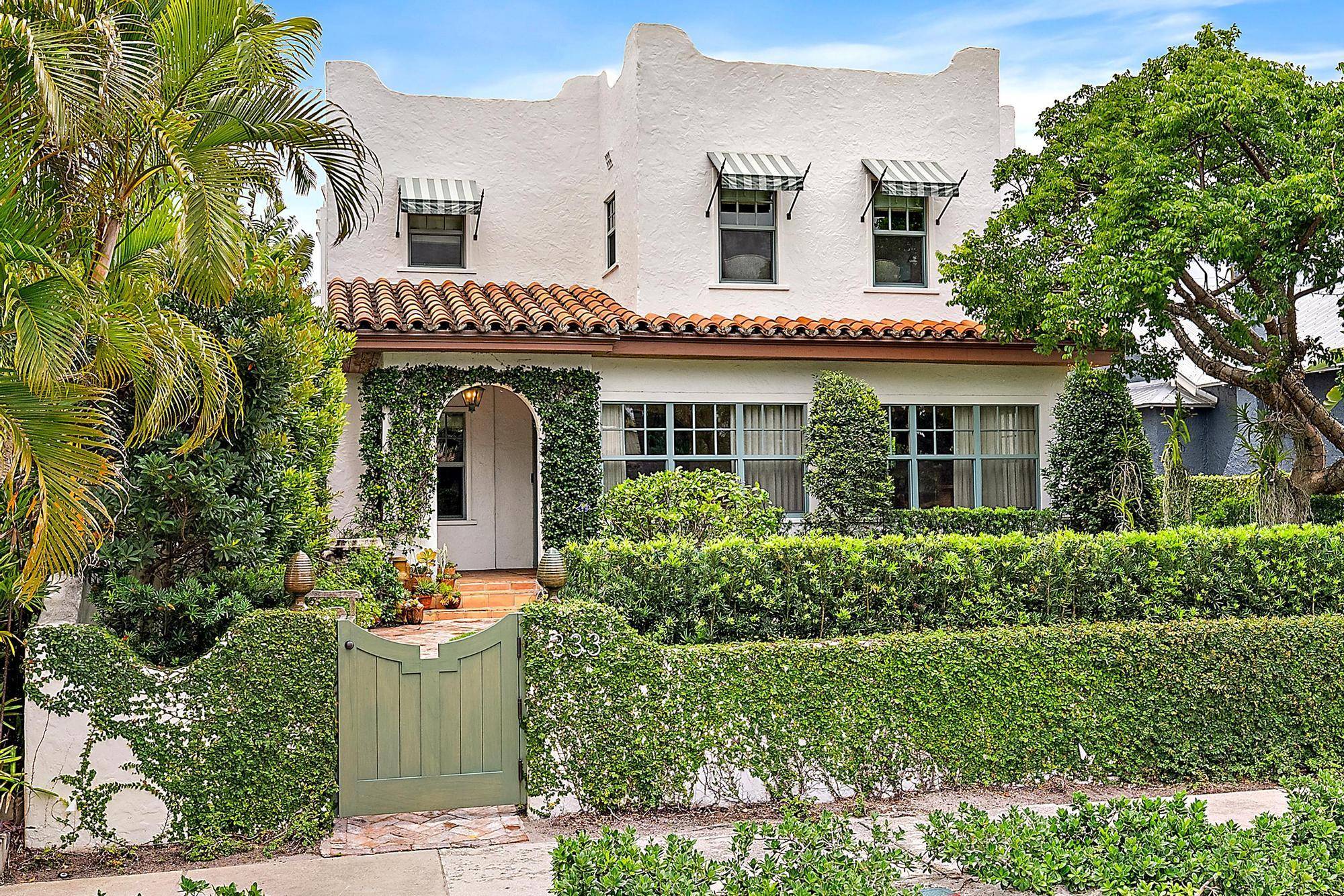 Meticulously renovated, this 1926 SoSo home offers a 3 bedroom main house as well as two private and self contained guest apartments in the rear of the property.