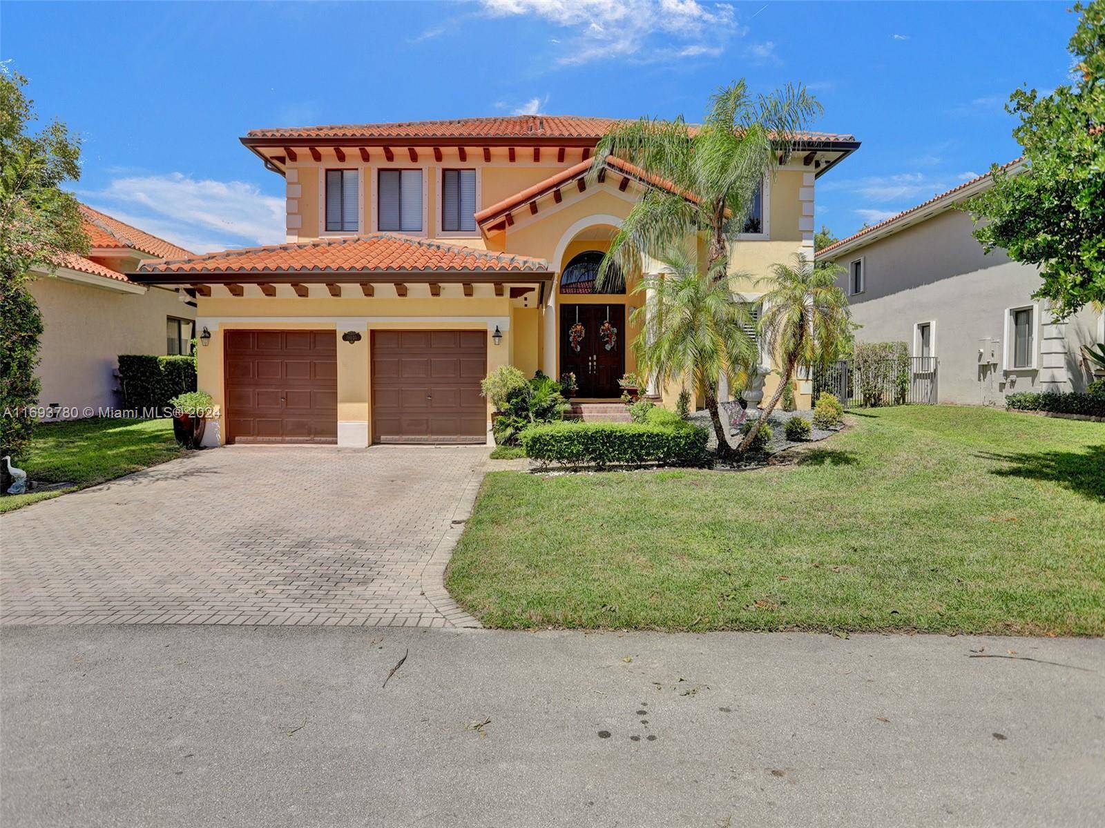 Beautiful five bedrooms, four baths with 2 car garages, high ceilings, and an ample paved driveway.