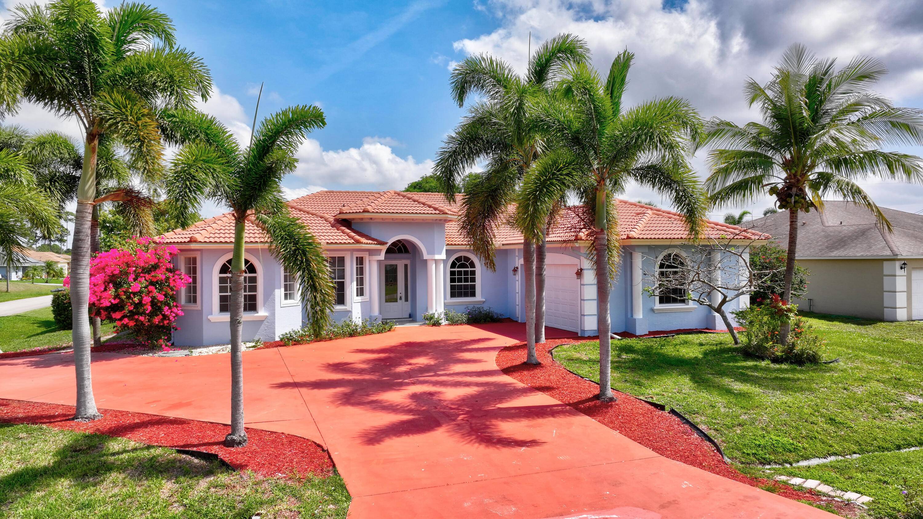 Welcome to this stunning custom built home perfectly situated on a spacious corner lot, featuring a grand circular driveway with ample parking for multiple vehicles.