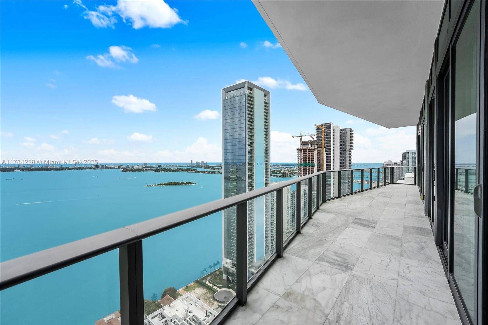 Soar above Biscayne Bay in this breathtaking south east corner penthouse at Icon Bay.