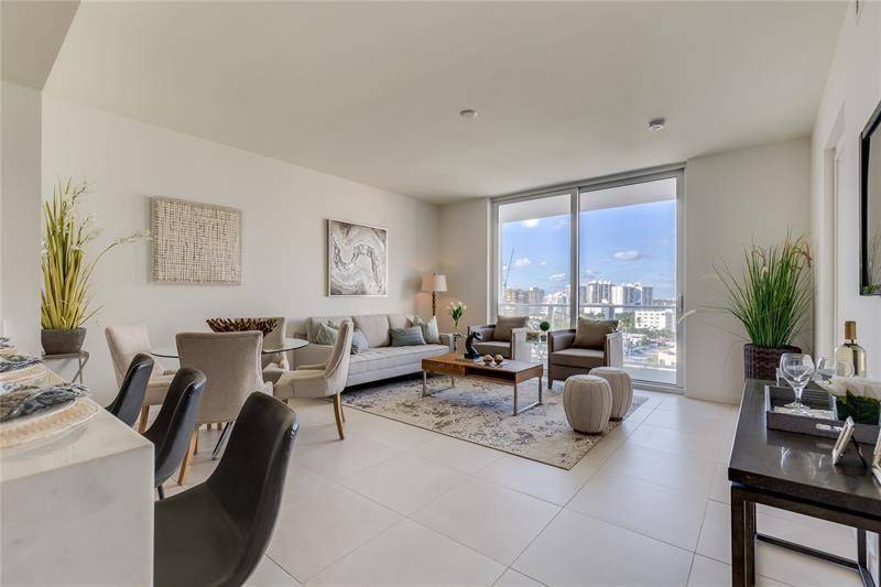 Designer Furnished 1 bedroom plus den in Luxury Tiffany House condo New condo building has two restaurants, two pools rooftop bar and much more !