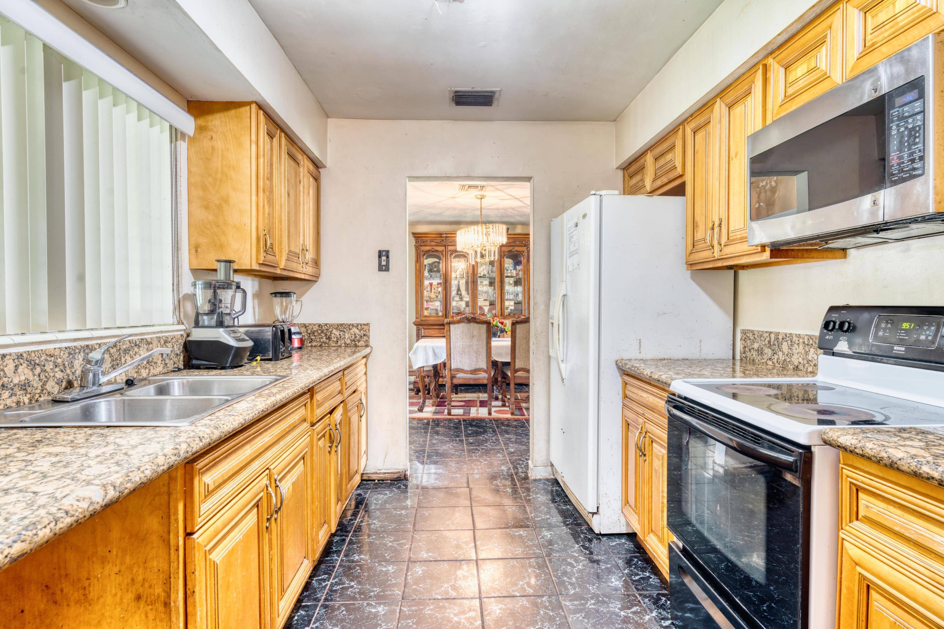 Discover endless possibilities with this spacious 4bedrooms, 2baths home full of potential !