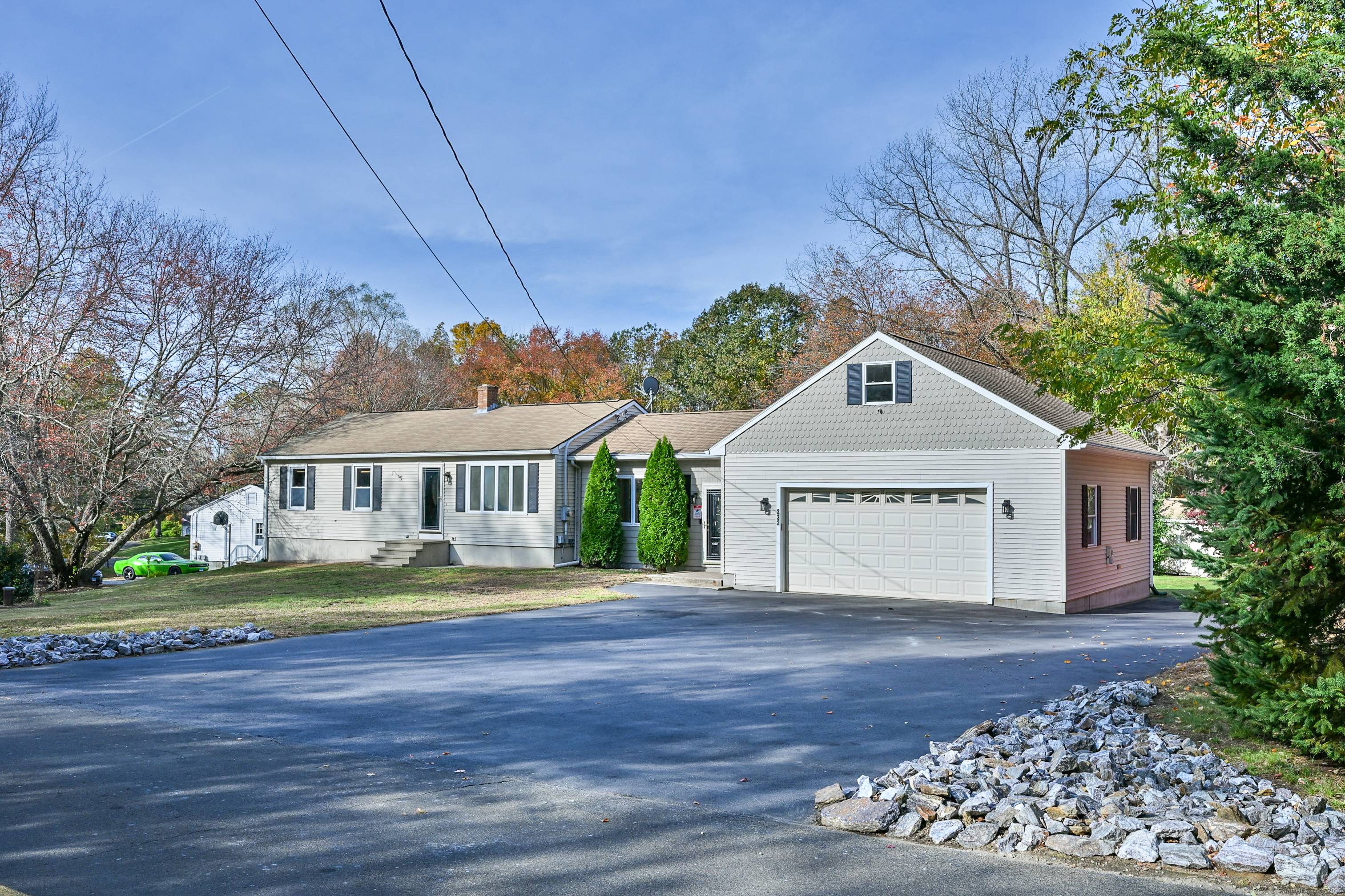 Discover the perfect blend of country charm and convenience at 232 Pompeo Road in Thompson, CT, just minutes from the Massachusetts border on a scenic farm road.