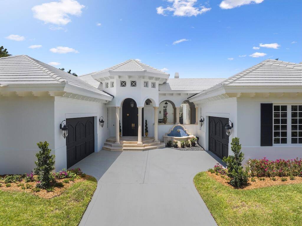 This beachside estate is 1 of just 12 custom homes, offering luxurious single story living w 4 bed, 3.