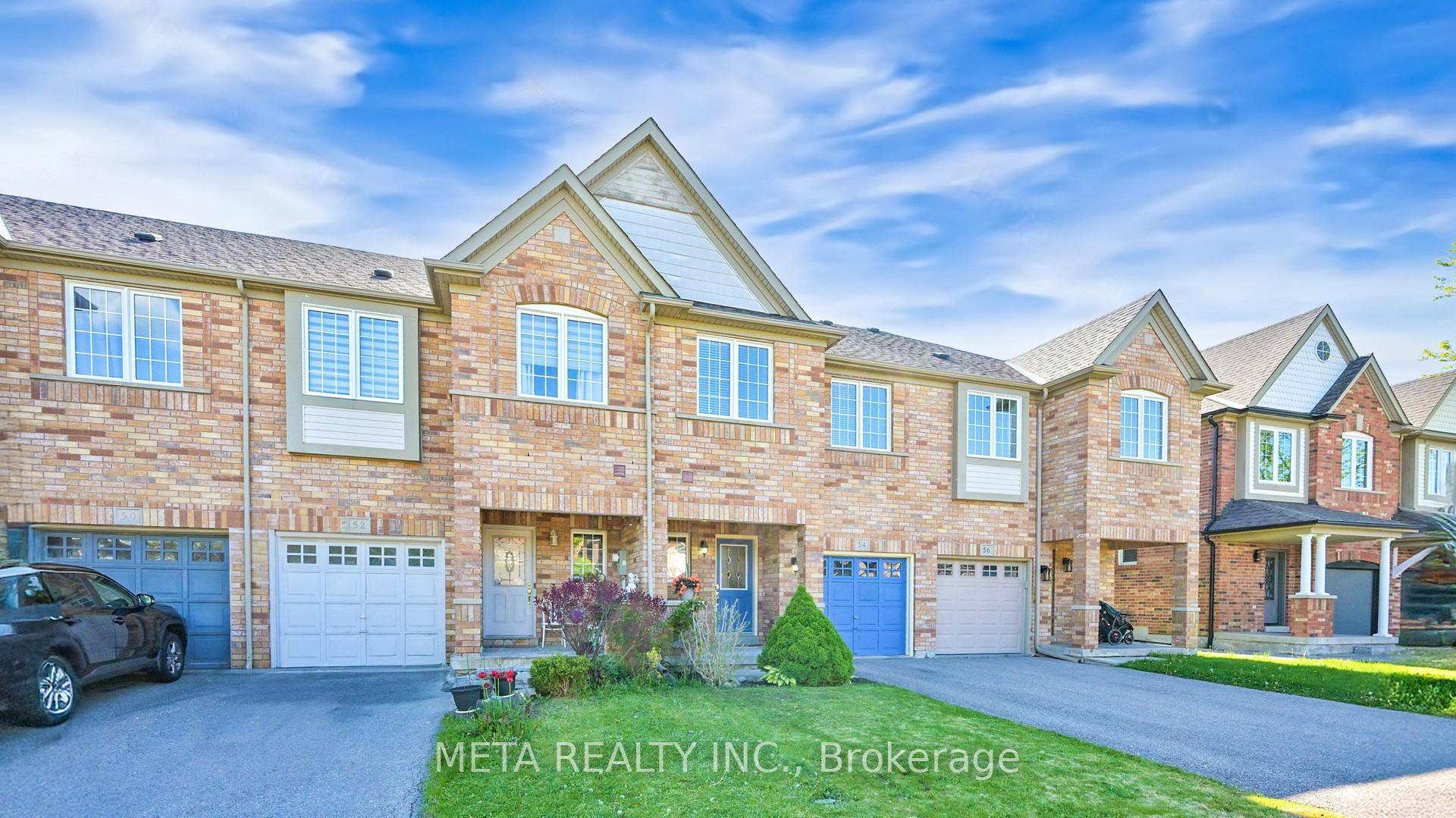 Move right into this bright, carpet free freehold townhouse featuring an elegant oak staircase and rich hardwood floors in the living room, complete with a cozy fireplace.