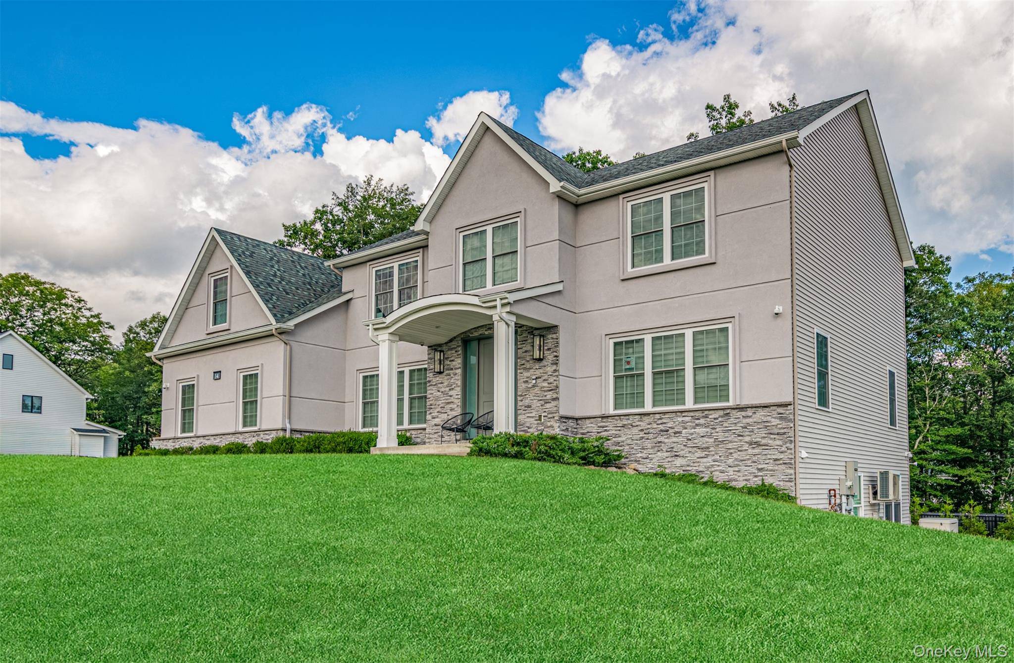 Custom Colonial in sought after Pomona showcasing a bright and open floor plan with high end finishings, including rich wide plank hardwood floors, built in speaker and security systems, and ...