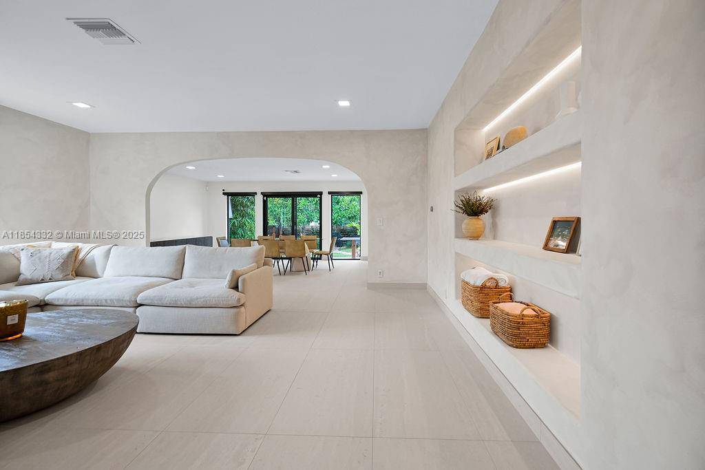 Welcome to Boho House, a charming three bedroom 2 1 2 bathroom in the heart of Hollywood Lakes.