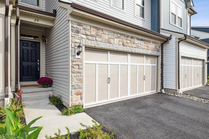 This newly built townhouse is perfectly situated on a cul de sac and you can't beat the location with the view of scenic trees.