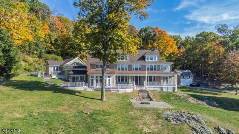 A once in a lifetime estate in Kinnelon and Montville with stunning views of your own private 25 acre lake Surprise Lake.