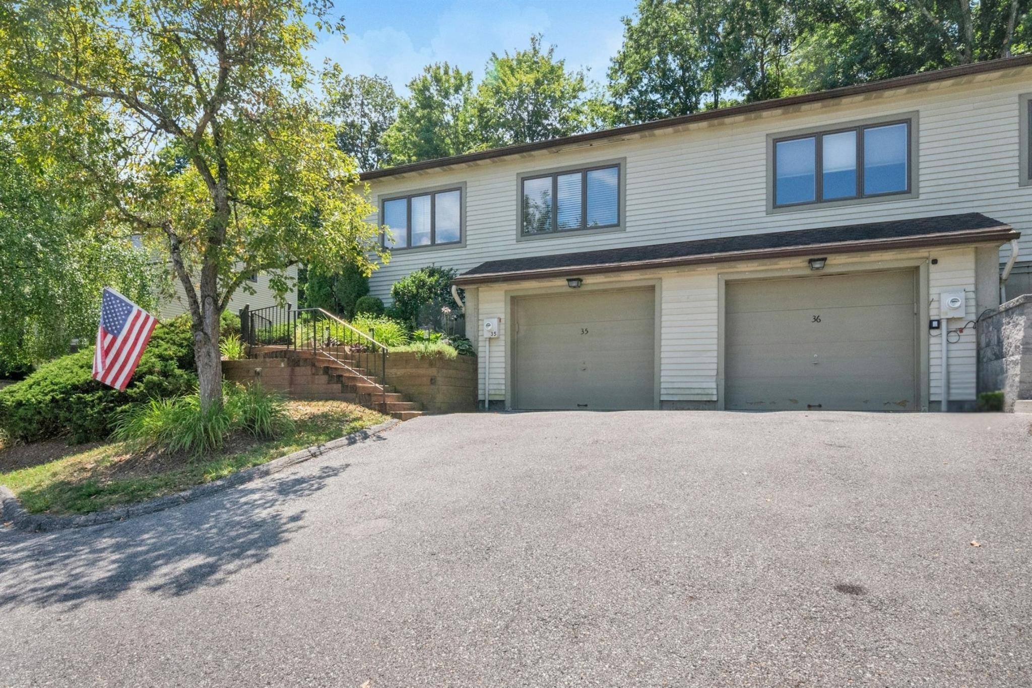 Move right into this sun filled, beautiful END unit with an attached garage offering the comfort and privacy of a single family home !