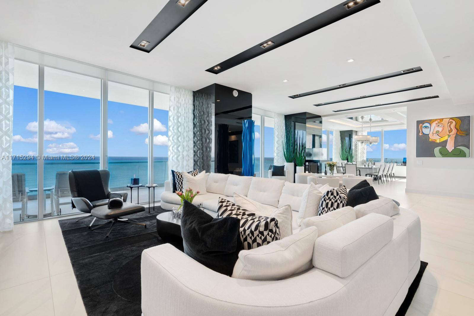 Experience unparalleled luxury in this meticulously designed corner flow through combination residence at Turnberry Ocean Club.