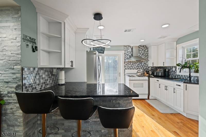 A true CUSTOM HOME ! ! ! From the beautiful brand new hardwood floors, new plumbing, electric, insulation, sewer line from the house to the street, electric heater fireplace, new ...