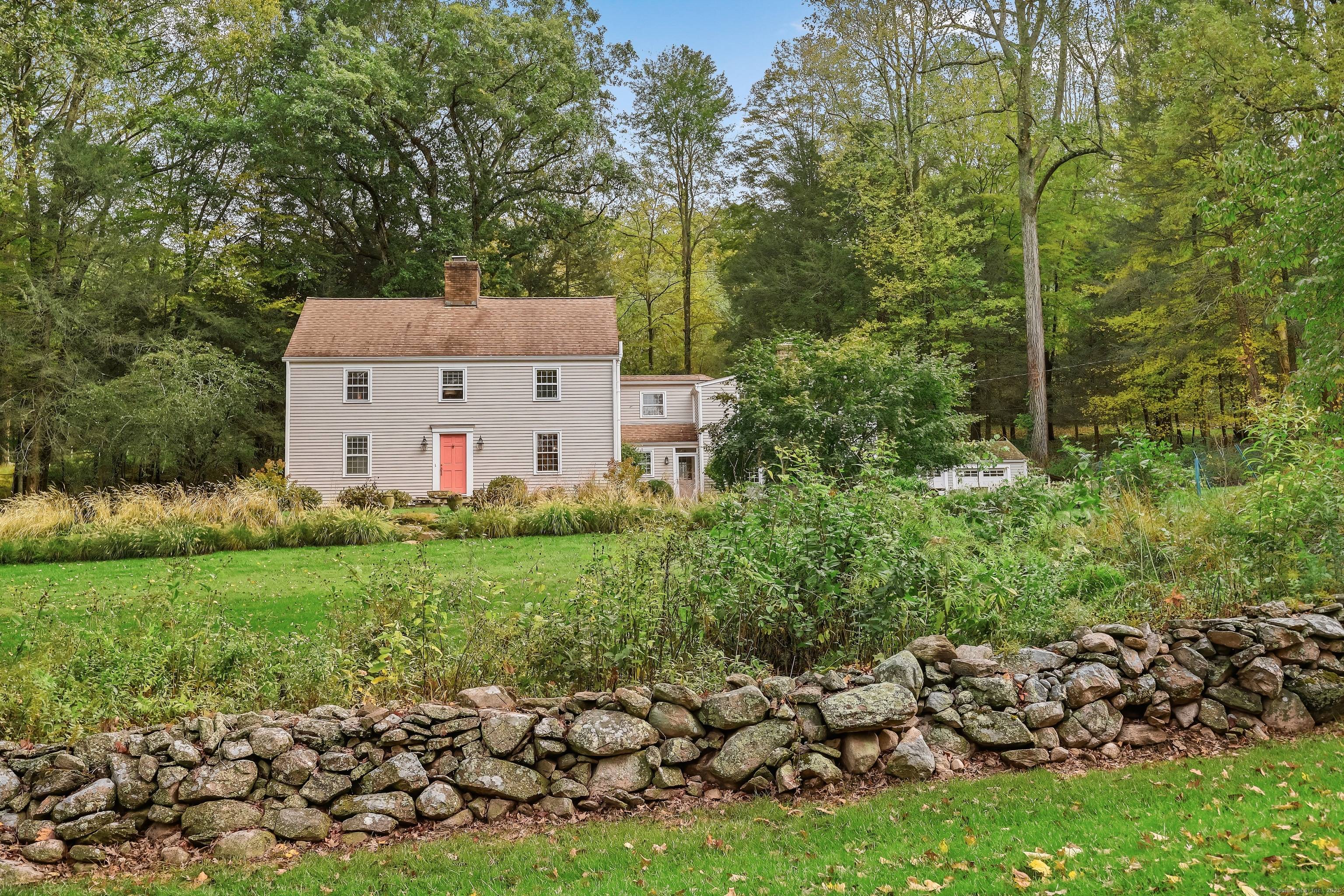 This distinctive Colonial offers tremendous curb appeal on a peaceful country road.