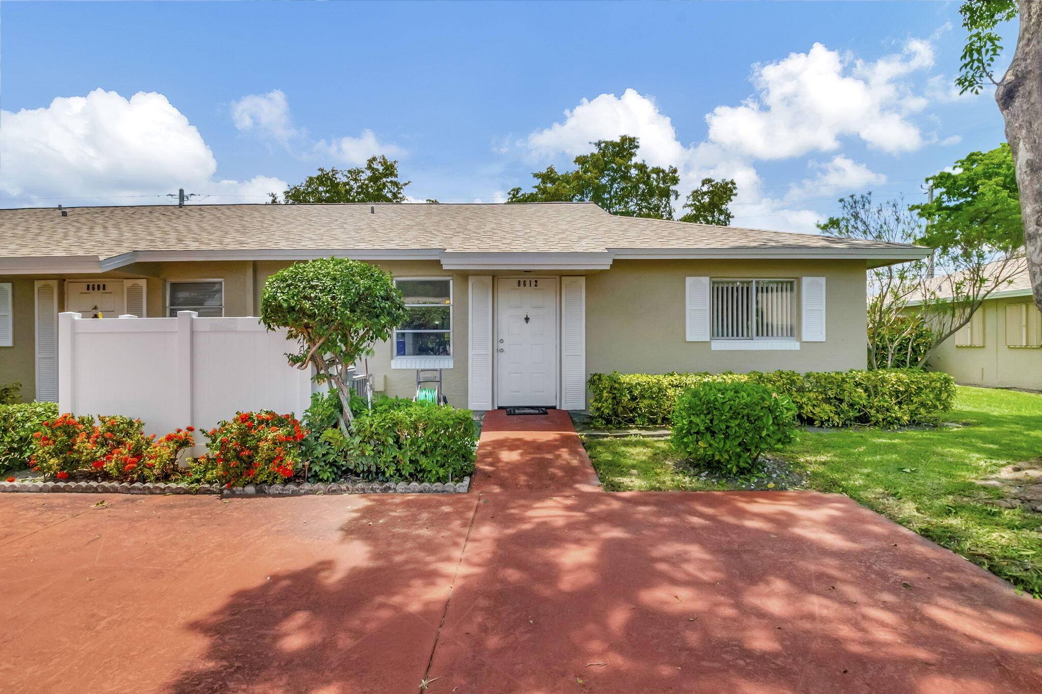 BEAUTIFULLY MAINTAINED 2 BEDROOM 2 BATH CORNER VILLA WITH A GARDEN VIEW AND 2 PARKING SPACES IN WHISPER WALK, ONE OF BOCA RATON'S MOST POPULAR COMMUNITIES.