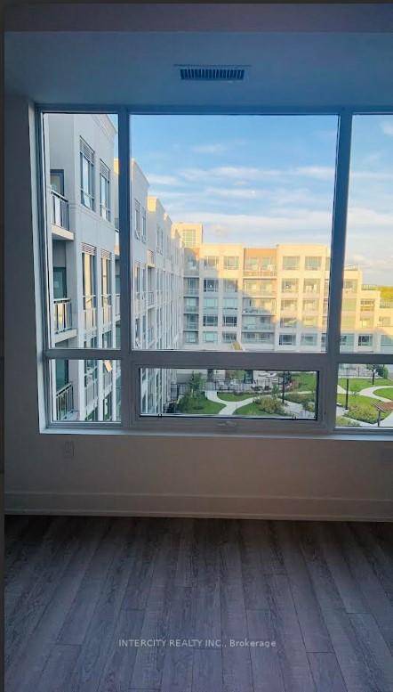 A stunning 660 sq. ft 1 bedroom den, 1 bathroom residence offering an elevated living experience with modern design, upscale finishes, perfect for evening light and outdoor relaxation.