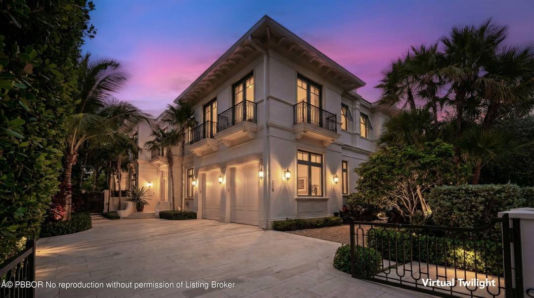 Stunning in town townhome appointed with lush landscaping.