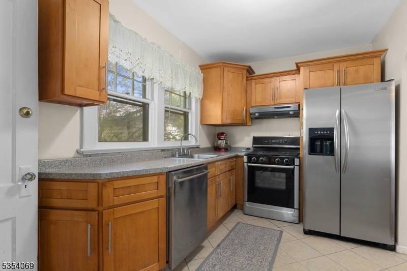Welcome to this charming Colonial style home in the heart of East Rutherford, ideally located across from a beautiful park.