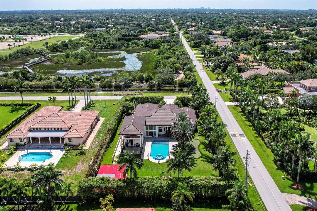 This exquisite Plantation Acres gated estate redefines luxury amp ; privacy.