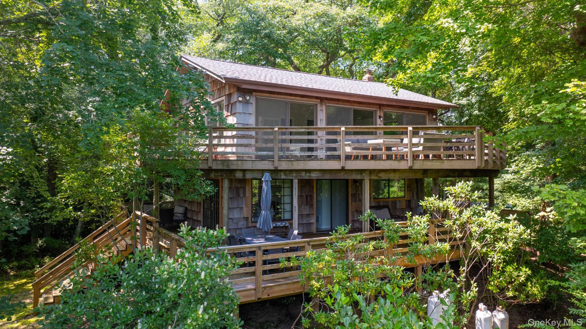 Modern Retreat in Water Mill Tranquil Hamptons Living Escape to serenity in the heart of the Hamptons with this beautifully updated 4 bedroom, 3 bathroom home, with hardwood floors, and ...
