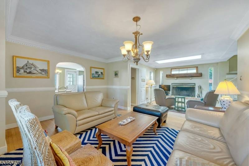 Welcome to this beautiful, expanded ranch situated on one of Pompton Plains' most desirable North End streets.