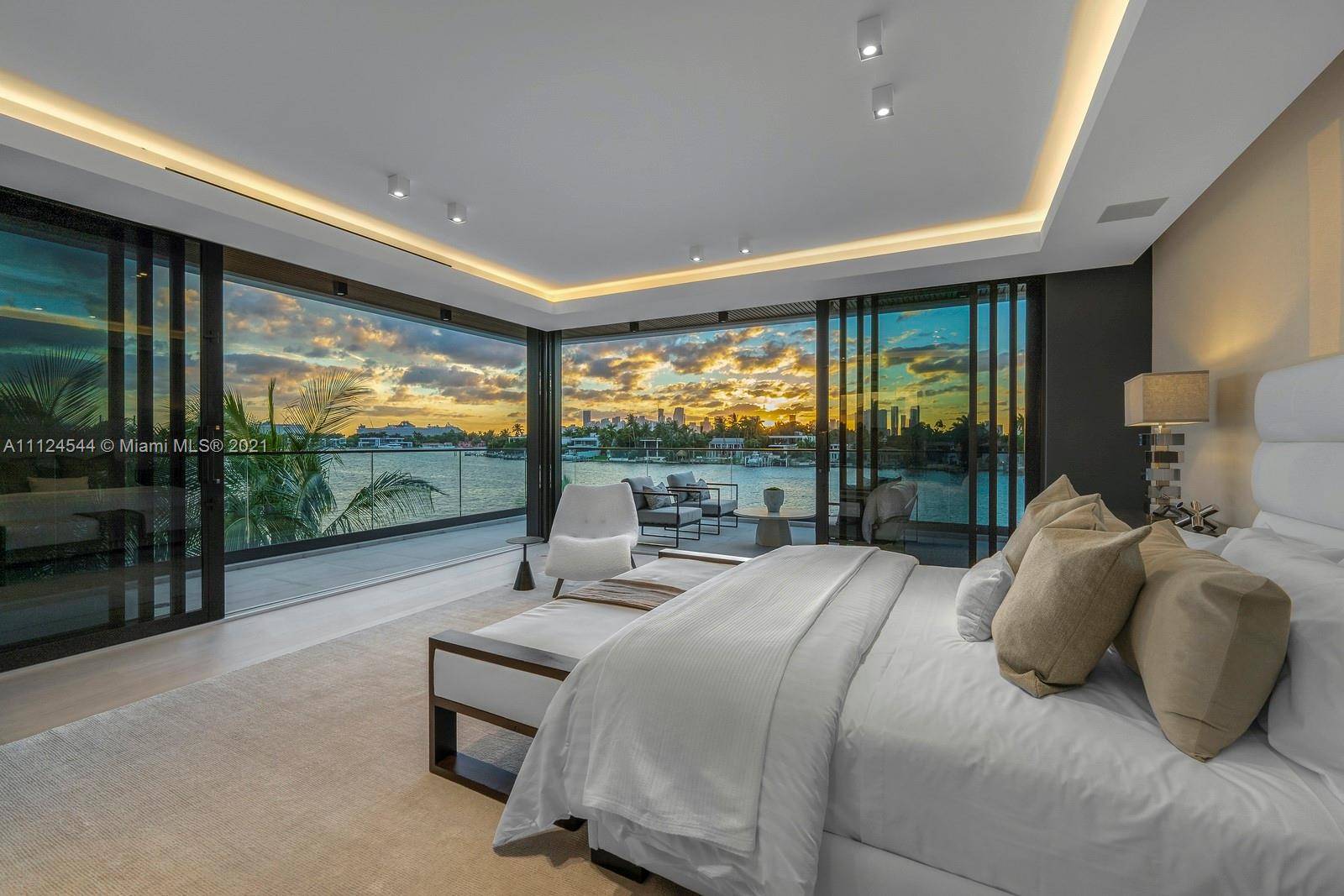 Masterfully designed nestled amongst lush, serene landscaping, this brand new tropical modern residence showcases a series of architectural moments, seamless indoor outdoor living an exquisite blend of luxurious materials, natural ...