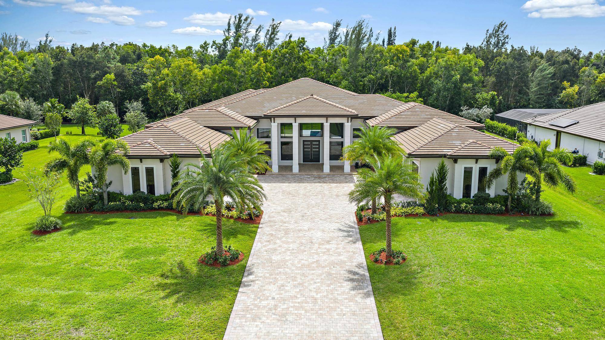 Architectural Masterpiece w approx 6599 of modern luxury living sqft, professionally landscaped backs to preserve.