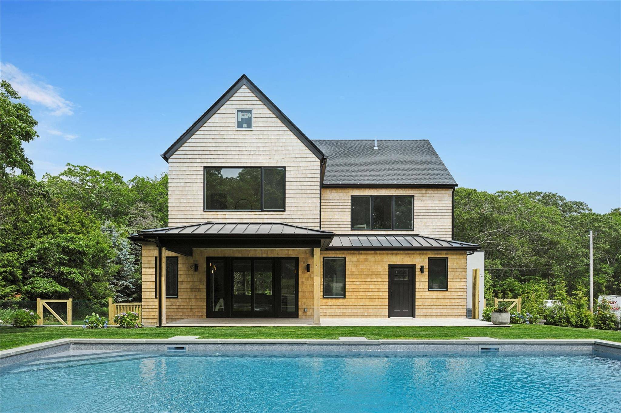 Beautiful Brand New Coastal Barn Style Retreat in Hampton Bays Welcome to 57 Newtown Road, where coastal modern elegance meets the timeless appeal of contemporary barn style architecture.