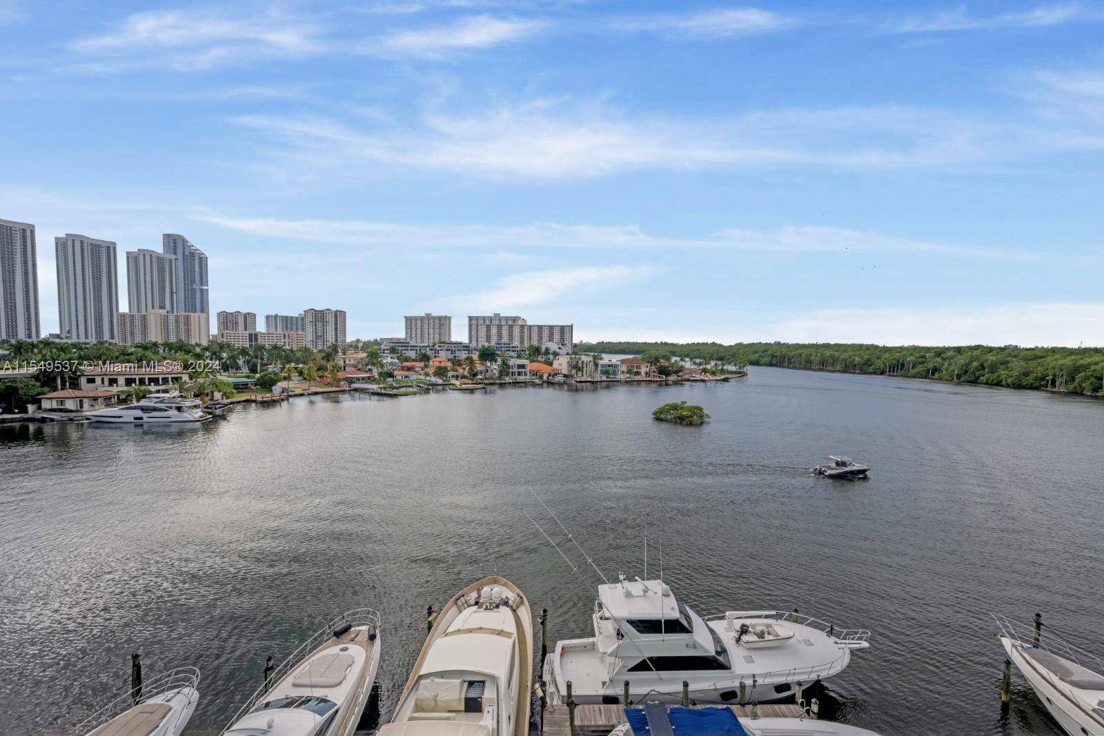 Indulge in the luxury of waterfront living in this exquisite 3 bedroom, 2 bathroom unit that boasts breathtaking views of the bay, ocean, and Oleta State Park.