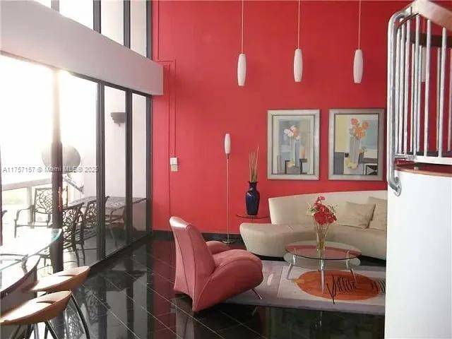 Experience luxury living in this stunning 2 bed, 2 bath tower suite with soaring 18 ft ceilings and breathtaking ocean, Intracoastal, and golf course views.