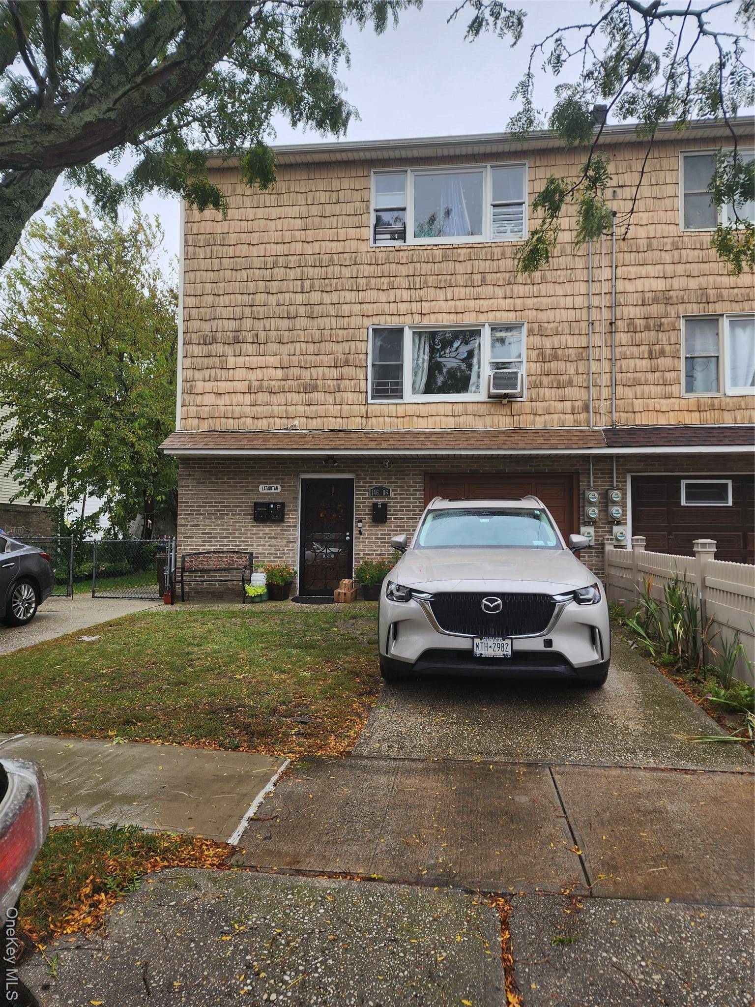 THREE FAMILY HOUSE, WALK IN FLOOR 1 BEDROOM, LIVING ROOM, KITCHEN, FULL BATH PLUS ATTACHED GARAGE.