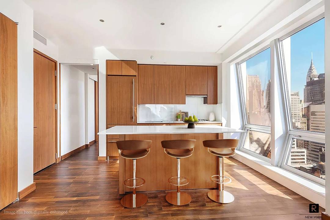 High floor corner 2BR 2. 5BA residence with sweeping South, East and West exposures at 400 Fifth Avenue, offering unobstructed city views and iconic sightlines of the Empire State Building.