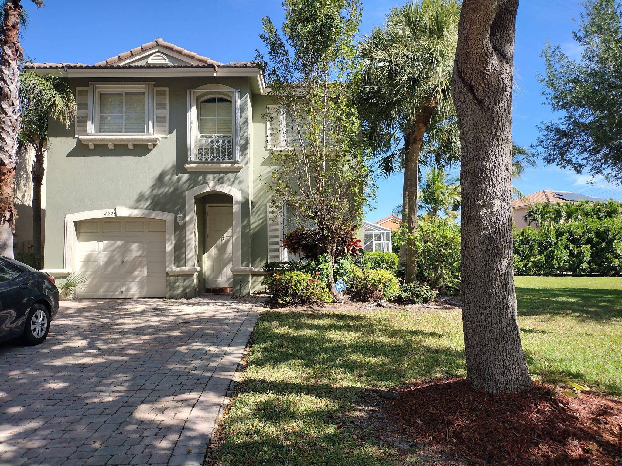 Beautiful 4 BR 2. 5 BA corner home with high ceilings, spacious living room, open floor plan, tile laminate floors, 1 car garage, stainless steel appliances, high efficient A C ...