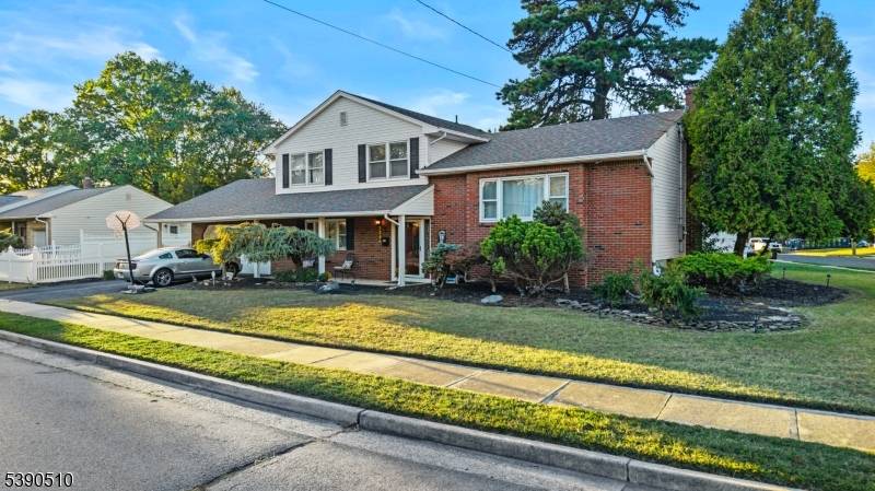 A beautifully updated, professionally landscaped custom split level in the heart of Milltown.