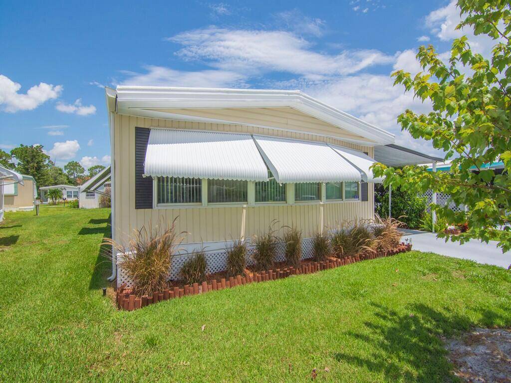 Welcome to 125 La Vaughn Circle in the sought after 55 community of Pinelake Village, Jensen Beach !