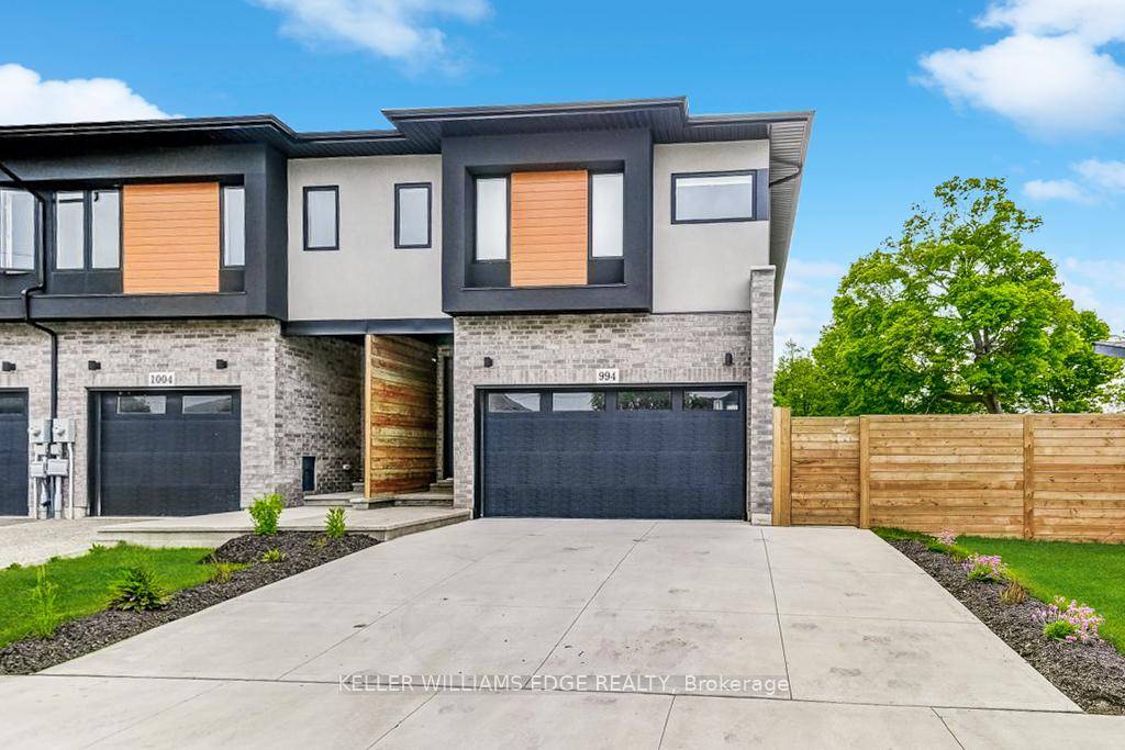Stunning MODERN FREEHOLD END UNIT Townhome with a spacious DOUBLE CAR GARAGE, loaded with high end finishes amp ; smart design.