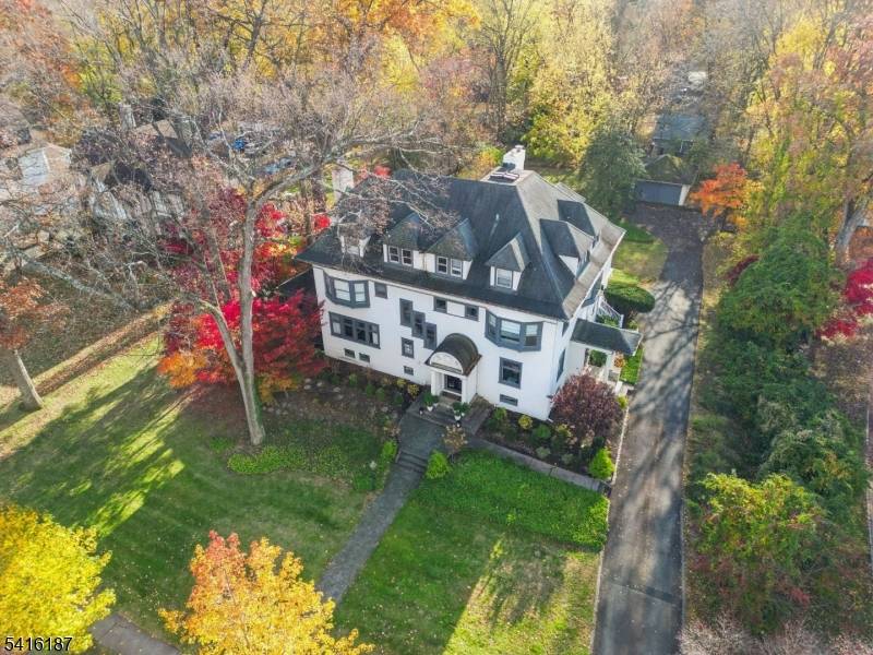 Welcome to this magnificent Colonial Revival estate on nearly three quarters of an acre, just 0.
