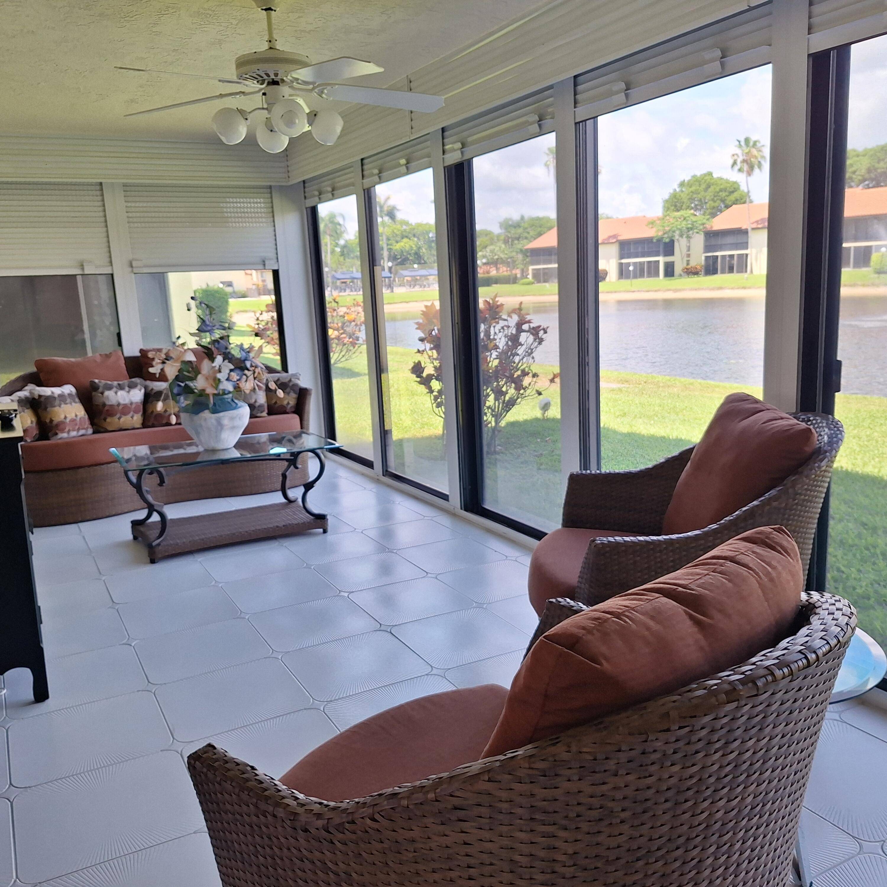 Bright, spacious, ground floor quad in sought after Palm Chase Lakes.