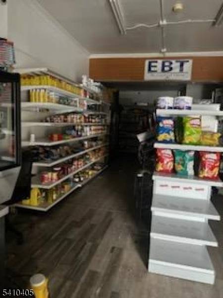 Mixed use property consisting of a store and 2 apartments.