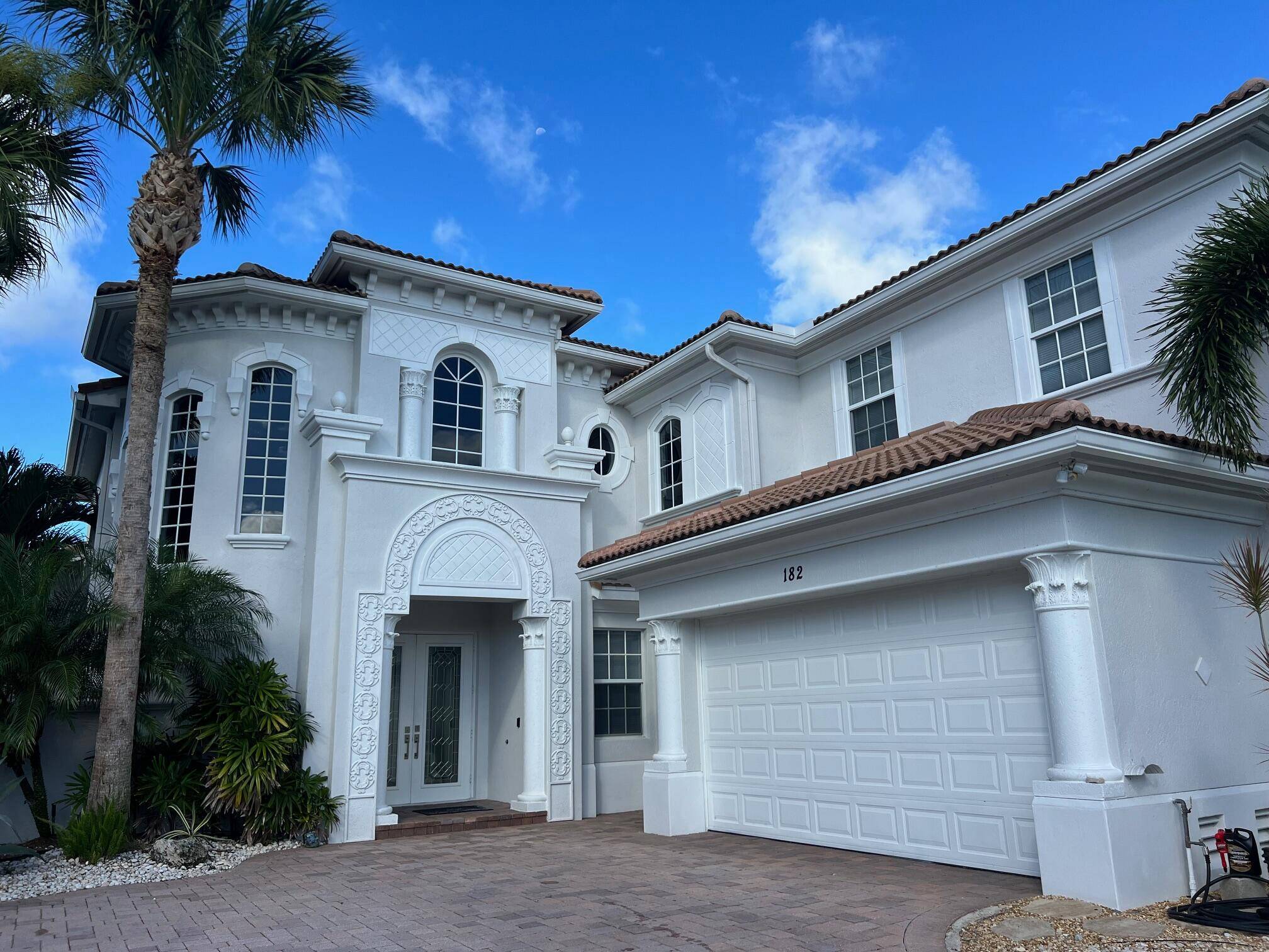 This custom home is light and bright with its 20' ceilings in the living dining areas and expansive views from all windows.