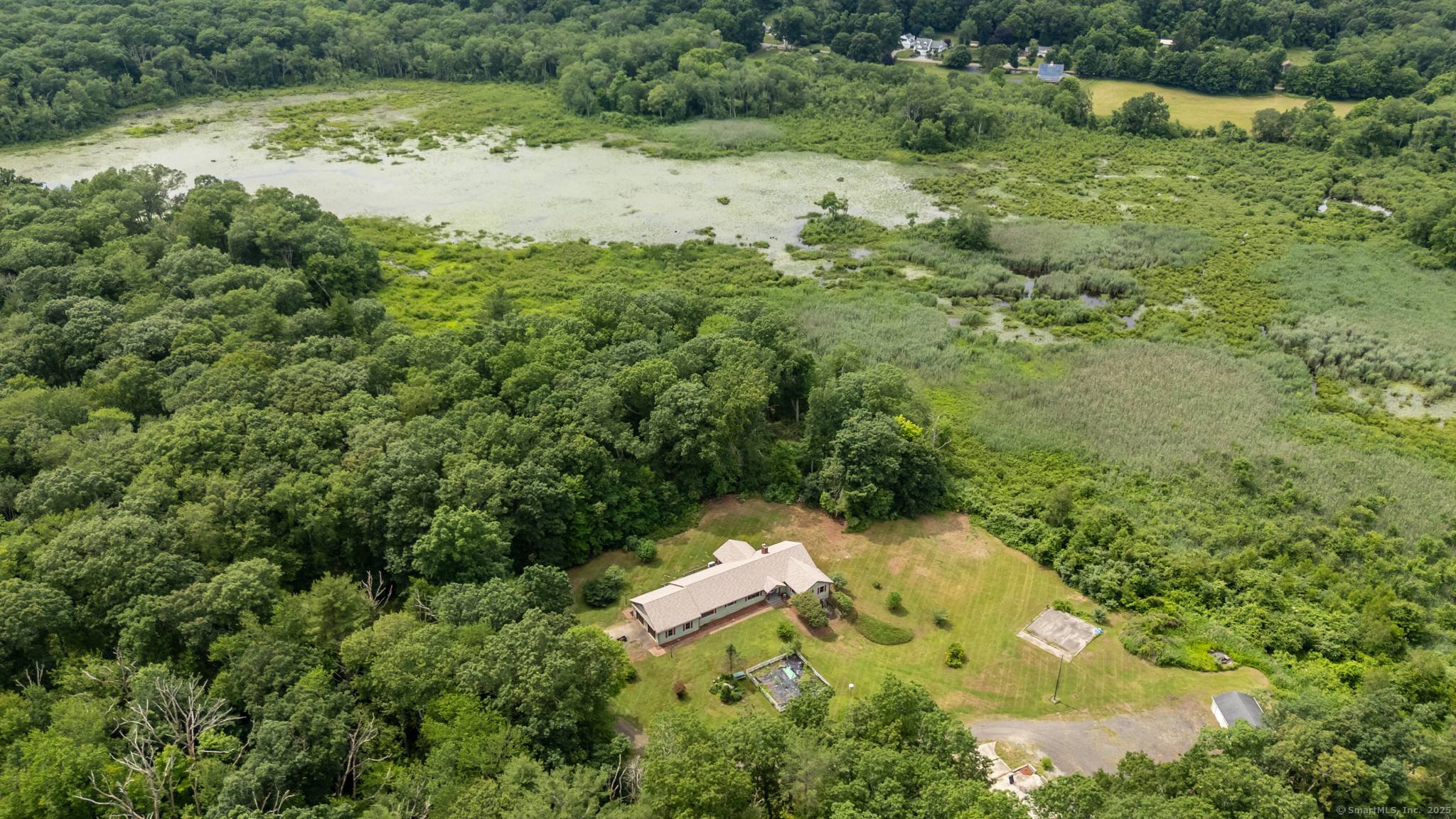 Tucked away at the end of a long, private driveway, this sprawling 2 bedroom ranch offers the ultimate in privacy and tranquility.