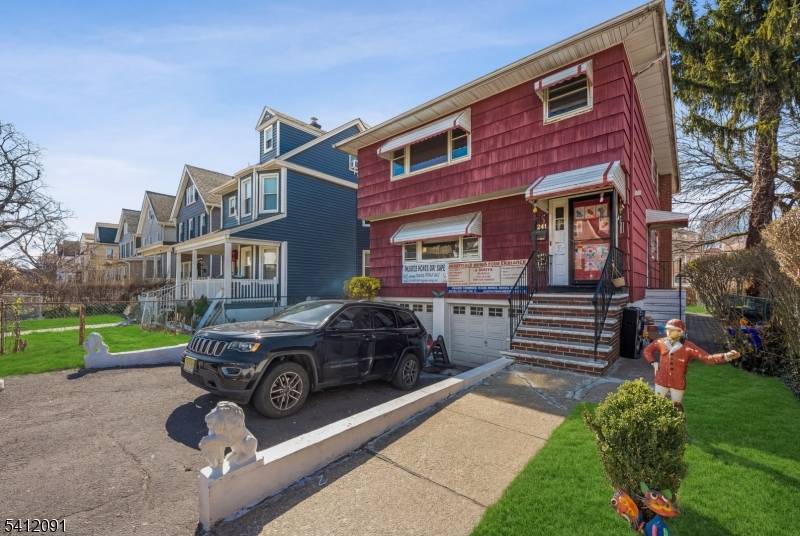 This spacious two family home offers 6 bedrooms, 2 full bathrooms, and 1 half bath, providing ample space for comfortable living, entertaining.