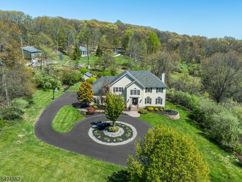 Tucked away on a quiet cul de sac and set on one of the most impressive lots in the neighborhood, this stunning 4 bedroom Colonial with a finished walkout basement ...