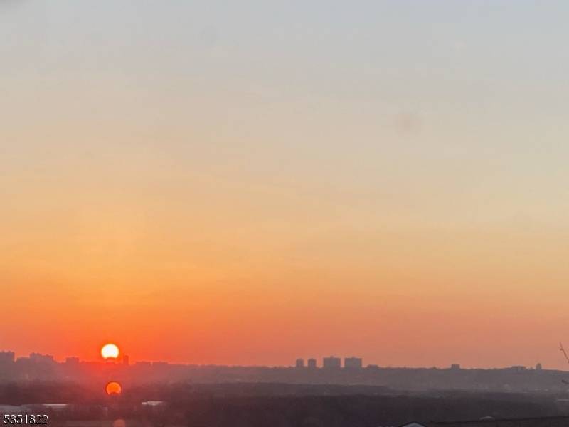 Welcome to 107 Hill Street in Wood Ridge, NJ, where stunning NYC skyline views meet suburban comfort.