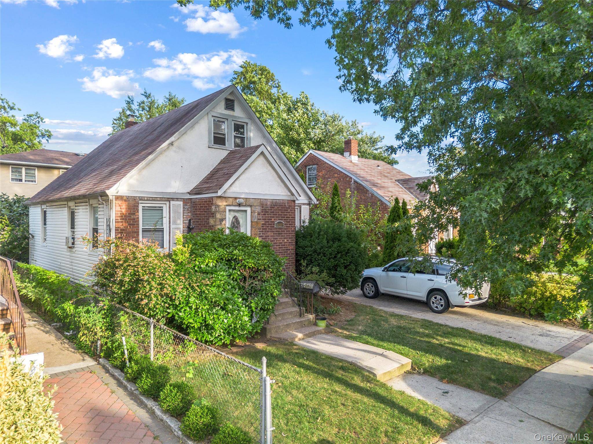 Welcome to 29 Butler Blvd, a beautiful Cape in Elmont offering a perfect blend of suburban tranquility and urban convenience.
